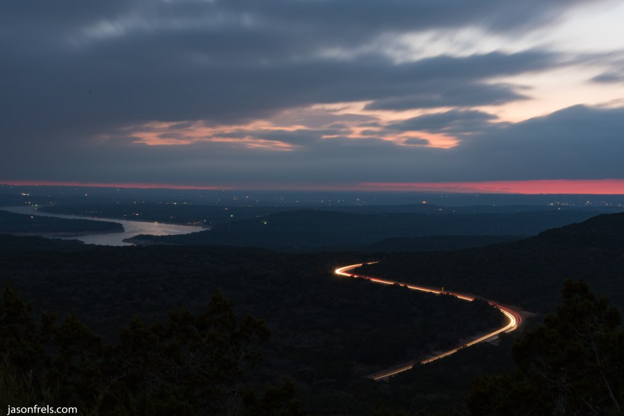Long exposure clouds and highway lake travis