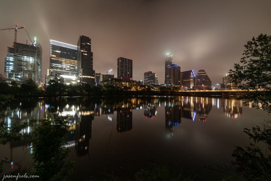 Downtown Austin Texas at cloudy predawn twilight reflected in Lady Bird Lake