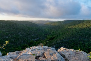 Sun rise at Lost Maples State Natural Area from high cliff