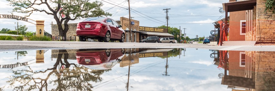 Reflections in a rain puddle in Liberty Hill Texas