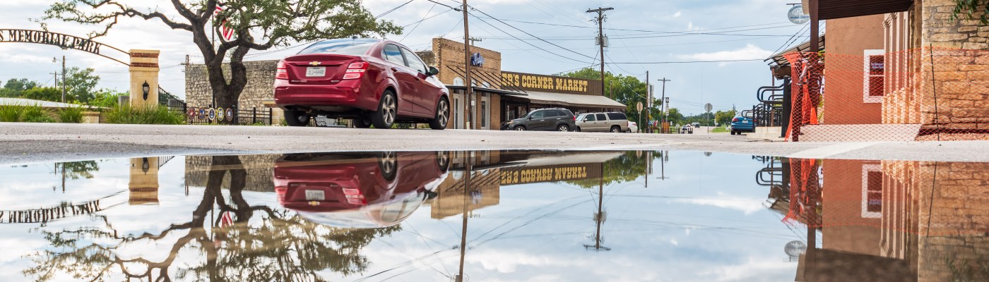 Reflections in a rain puddle in Liberty Hill Texas