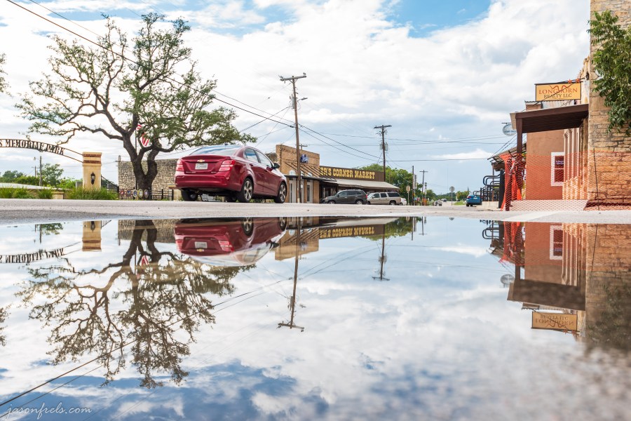 Reflections in a rain puddle in Liberty Hill Texas