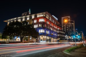 Austin Central Libary at night in color with blurred car lights