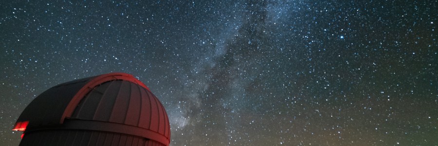 Milky Way over telescopes at the McDonald Observatory in Texas